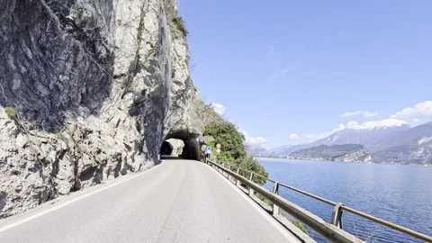 POV Massive Vertical Cliff Rock Net Tunnel Lake Garda Italy Alps 4K HDR Stock Footage 331205622
