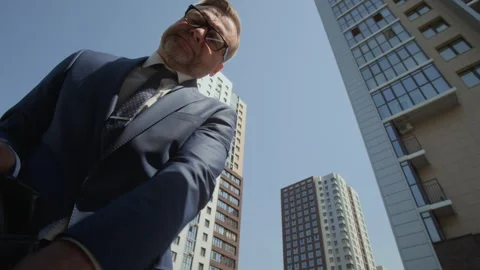 POV of Middle Aged Businessman Checking Watch, Taking Briefcase from Car Trunk Stock Footage 343375422