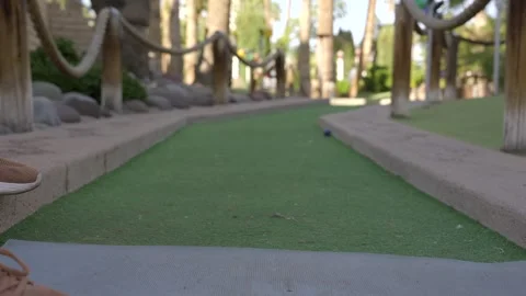 POV mini gulf ball gets hit Stock Footage 272805495