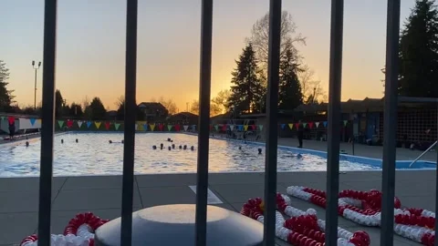 POV Motion of Outdoor Pool Sunset with anonymous people Stock Footage 282557783