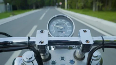 POV of motorcycle driver driving his chopper through the mountain empty road Stock Footage 150617448