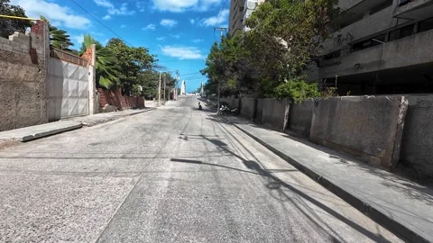 POV motorcycle ride through La Guaira, Venezuela, revealing collapsed Vídeo Stock 342597047