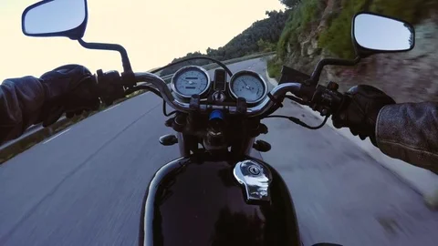 POV of motorcycle riding through sunset road Stock-Footage 76826835