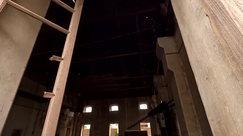 POV Moving Through Broken Window into Vast Abandoned Industrial Hall Stock Footage 341033763