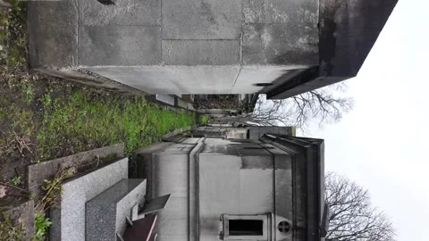 POV Narrow path through burial crypts and mausoleums in Montmartre Cemetery Stock Footage 330910767