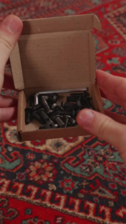 POV opening small hardware box containing assembly screws Stock Footage 346396486