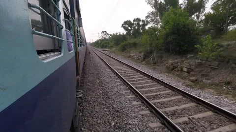 POV or first hand view of a train in india. Camera out of the train rolling next 库存影片 297015631