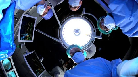 POV Orthopedic surgical operation performed by multi ethnic medical staff on Stock Footage
