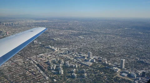 POV OUT WINDOW OF LEAR JET OVER CITY Stock Footage 45203997