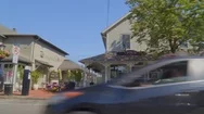 Pov Panning Shot Of Shops And Restaurants In Roslyn Village Long Island Stock Footage