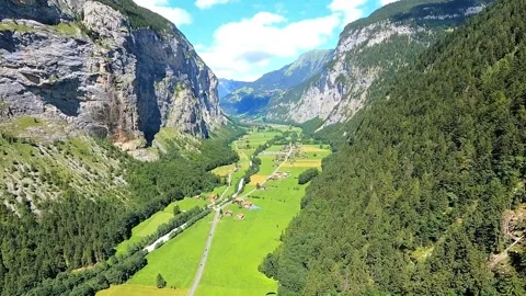 POV paragliding looping flips over Lauterbrunnen Valley in Switzerland Stock Footage 258482989