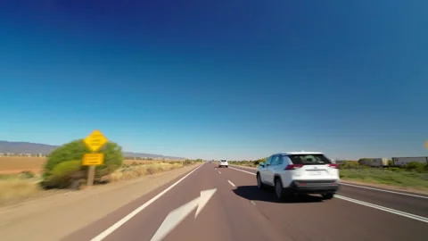 POV parallel driving to railway cargo train on Australia Outback Stuart Highway Stock Footage 273171622