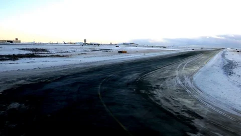 POV passenger view looking during taxi in runway of airport with snowy winter Stock Footage 93219063