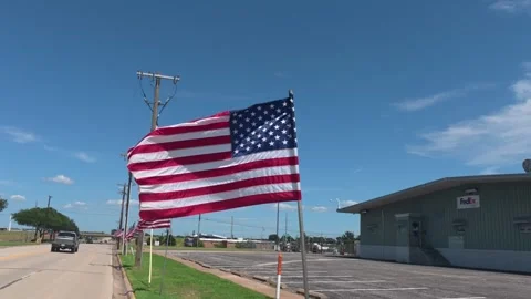 POV Passing Multiple American Flags Along Roadside in Wichita Falls Texas 4K 스톡 동영상 336904321