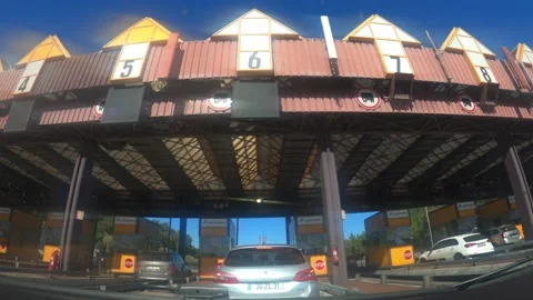 POV of passing thorugh a the point of toll highway, toll station near the 25 Stock Footage 164610976
