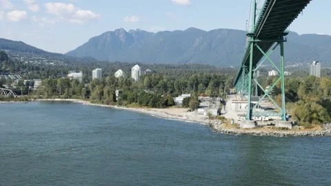 POV-Passing under the Lions Gate Bridge at Vancouver harbor Stock Footage 208238533