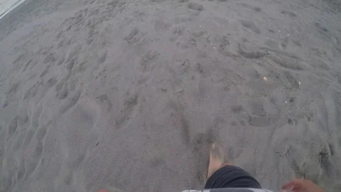 POV Person walking alone on a sanded beach Stock Footage 78167090