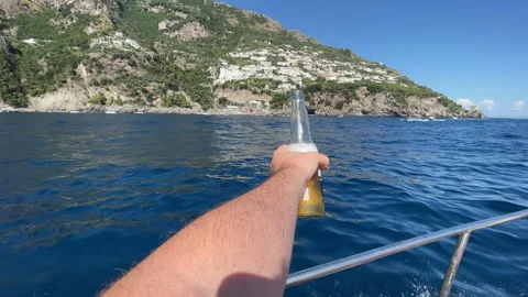 POV of persons hand holding refreshing drink against background of amazing Video stock 316887441