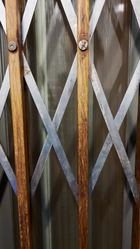 POV from phone going down by elevator inside old building in Europe with Stock Footage 341324803