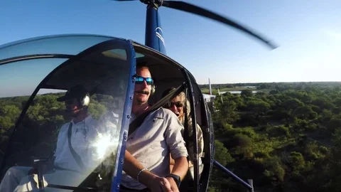 POV from pilot and tourists from the inside of a heliopter while flying over the Stock Footage 78196803