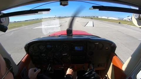 POV of the pilot of a small plane with a propeller taking from a runway Stock Footage 148534849