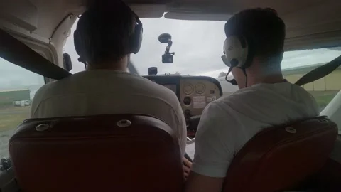 POV Pilots Conversing Inside Private Plane While Taxiing On Runway - close Video stock 202021946