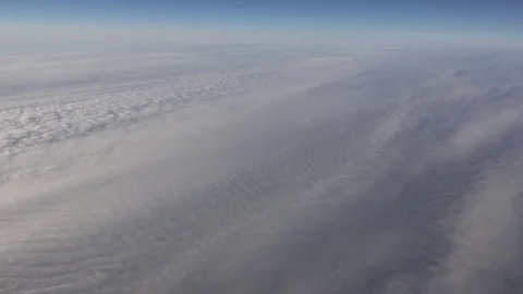 POV Point of view airplane fly over cloud formation air jet flight airliner trip Stock Footage 81986653