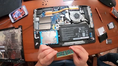 POV Point of view Changing Laptop RAM Memory At Home Watching Tutorials Stock Footage 147461108