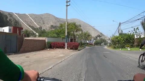 Pov point of view cycling down the street el peñon in la planicie Stock Footage 143044855