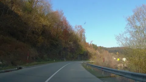 POV, point of view of driving a car on countryside road in small village Stock Footage 169248291