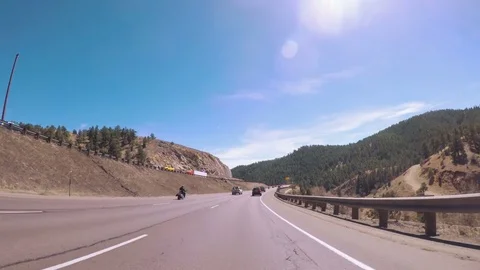 POV point of view - Driving on interstate highway I70 in the mountains in Early Stock Footage