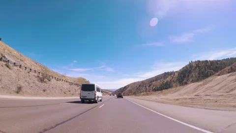 POV point of view - Driving on interstate highway I70 in the mountains in Early Stock Footage