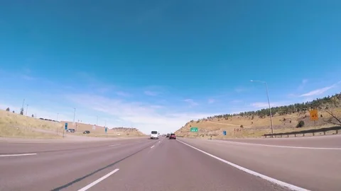 POV point of view - Driving on interstate highway I70 in the mountains in Early Stock Footage