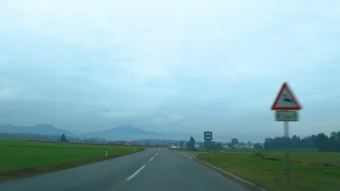 POV point of view driving on straight paved countryside road in Slovenia Stock Footage 142697267
