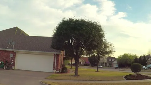 Pov. Point of view - Driving through residential neighborhood in spring time. Stock Footage 73899805
