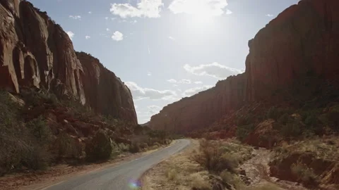 POV point of view driving through Escalante Utah canyon in dry season, afternoon Stock Footage 248577136