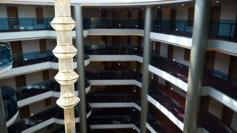 POV, Point of View from inside the glass elevator of a multi-storey hotel. Video stock 77287276