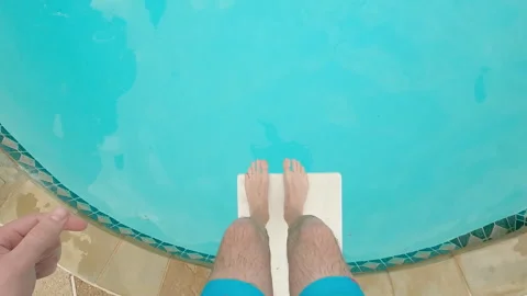 POV point of view looking down at feet walking on diving board, jumping in pool Vídeo Stock 248080126