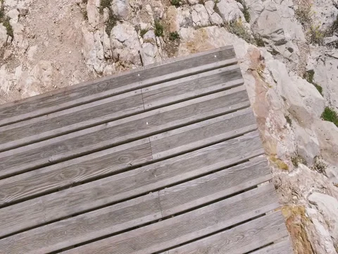 POV point of view Man Walking thru the rocks to the sea Stock Footage 63749217