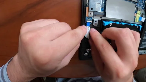 Pov point of view putting a laptop ssd disk connector 库存影片 147460765