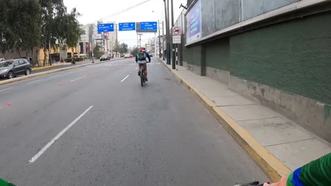 POV point of view riding a bicycle along El Polo avenue, Surco, Lima, Peru 動画素材 142673456
