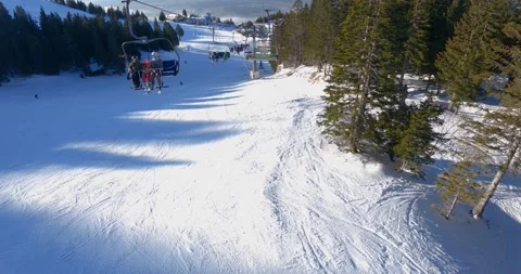 POV point of view riding with ski elevator in winter resort Krvavec, Slovenia Stock Footage 147684211