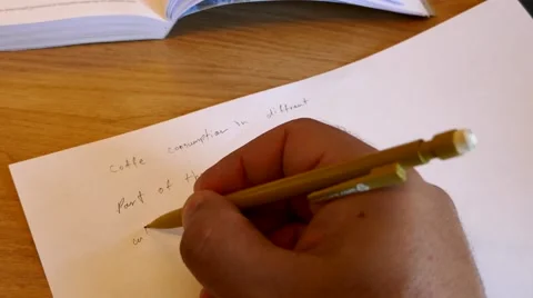 POV point of view of student in classroom writing a text and looking at teacher Stock Footage 63015302