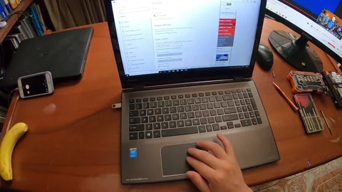 Pov point of view testing a laptop after installing an operating system Stock Footage 147461025