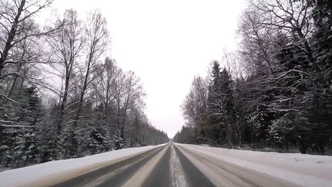 POV point of view-the view from a moving car out of town in the winter Stock Footage 86193882