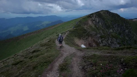 POV point of view walking along hiking mountain trail path, People Footsteps Stock Footage 79684493