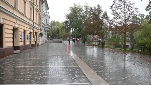 POV point of view walking in Ljubljana city, Slovenia on rainy gloomy day Stock Footage
