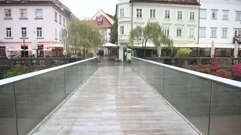 POV point of view walking over narrow footbridge in Ljubljana city, Slovenia Stock Footage 142102293