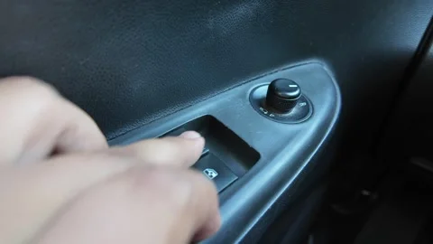 POV Pressing Power Window Control Button in Car Stock Footage 343577498
