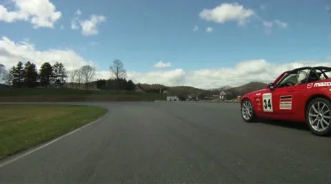 POV race car rounds track Stock Footage